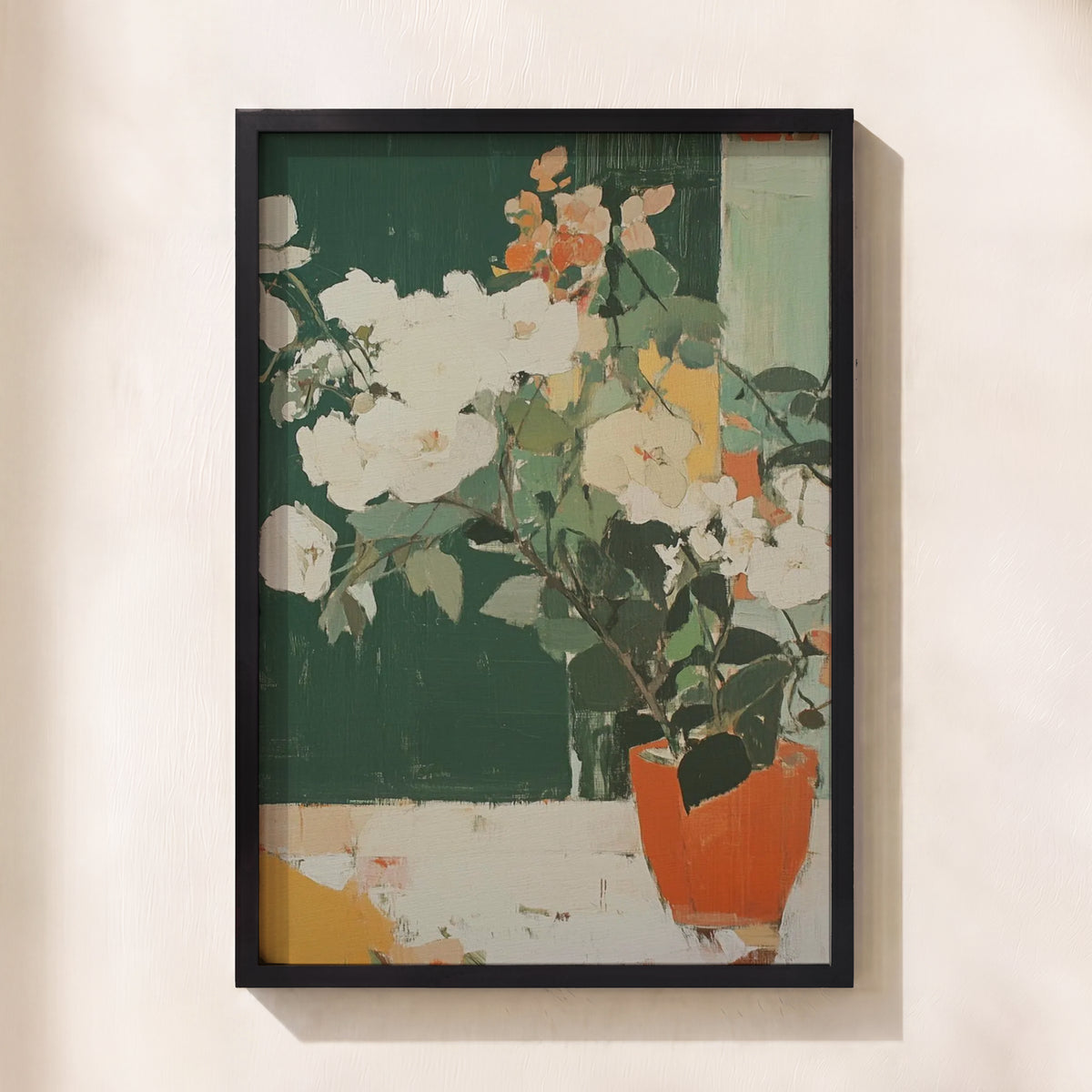 A framed abstract floral painting featuring white blossoms, green leaves, and an orange pot against a dark green and cream background, hung on a light beige wall.