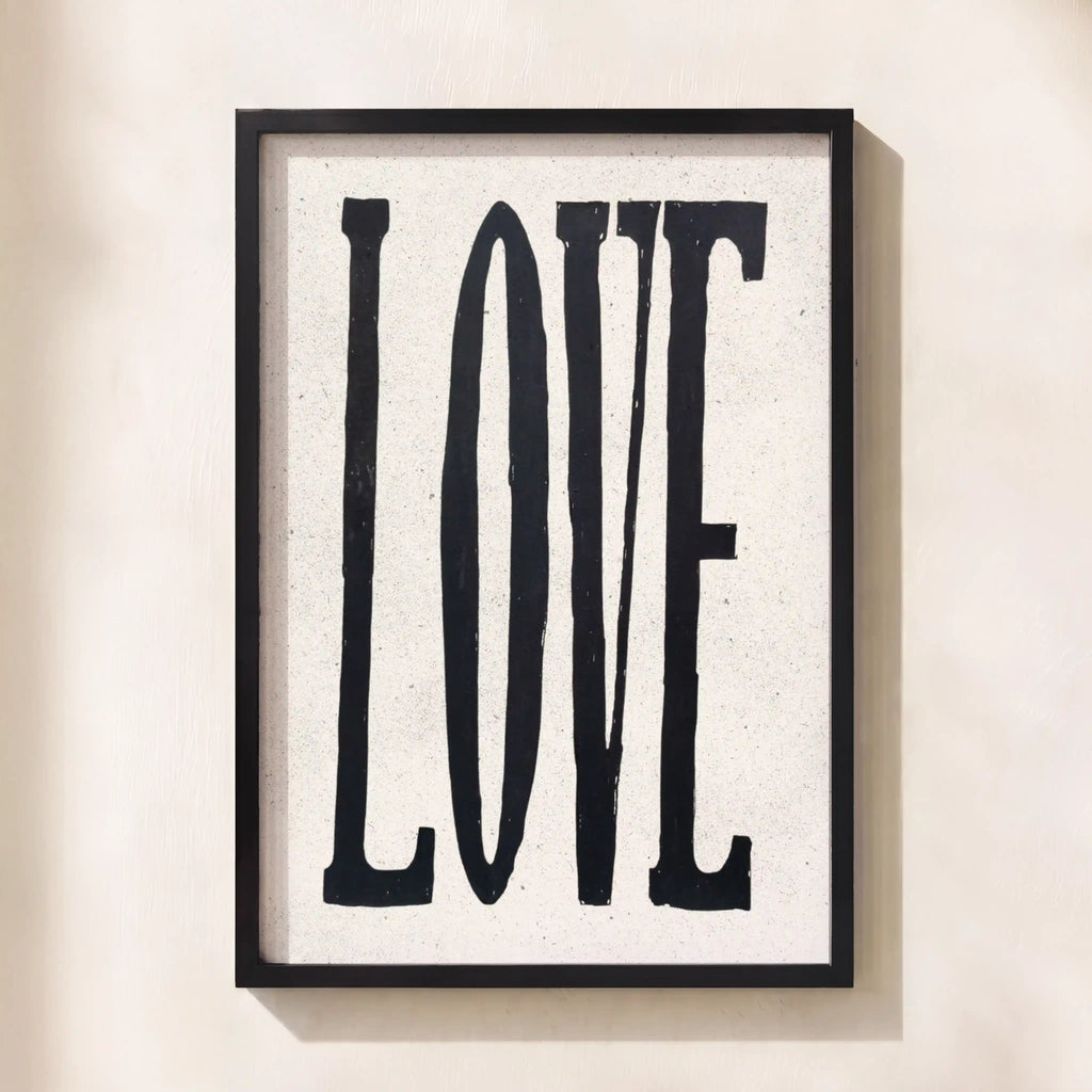 Framed artwork with the word 'LOVE' on a light background