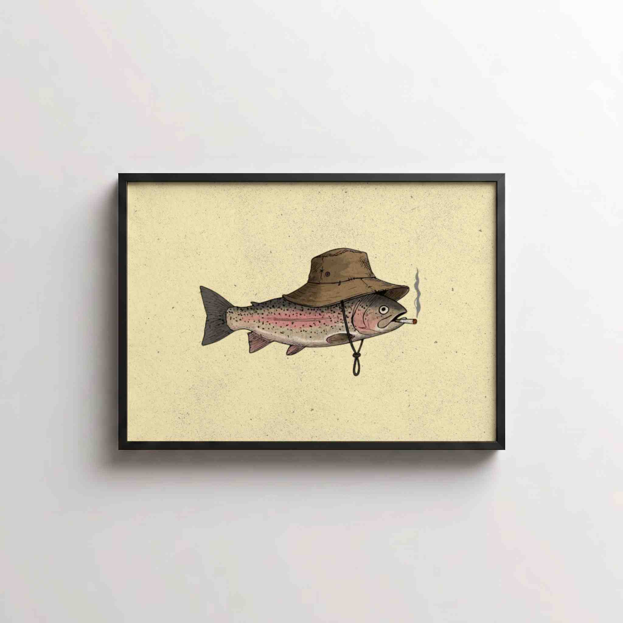 Framed wall art featuring an illustrated fish wearing a brown wide-brim hat on a warm cream background, shown hanging against a light gray wall.