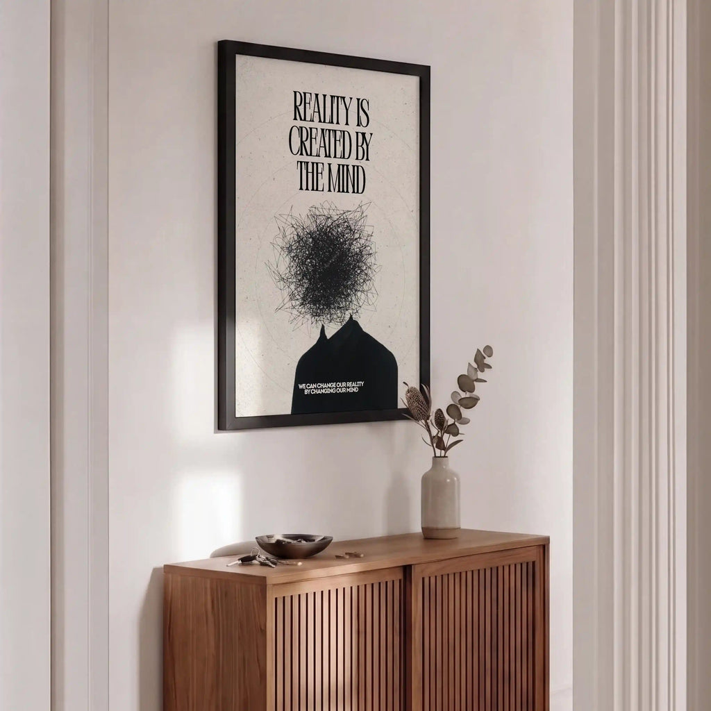 Wooden sideboard with a vase and decorative items, framed artwork on the wall.