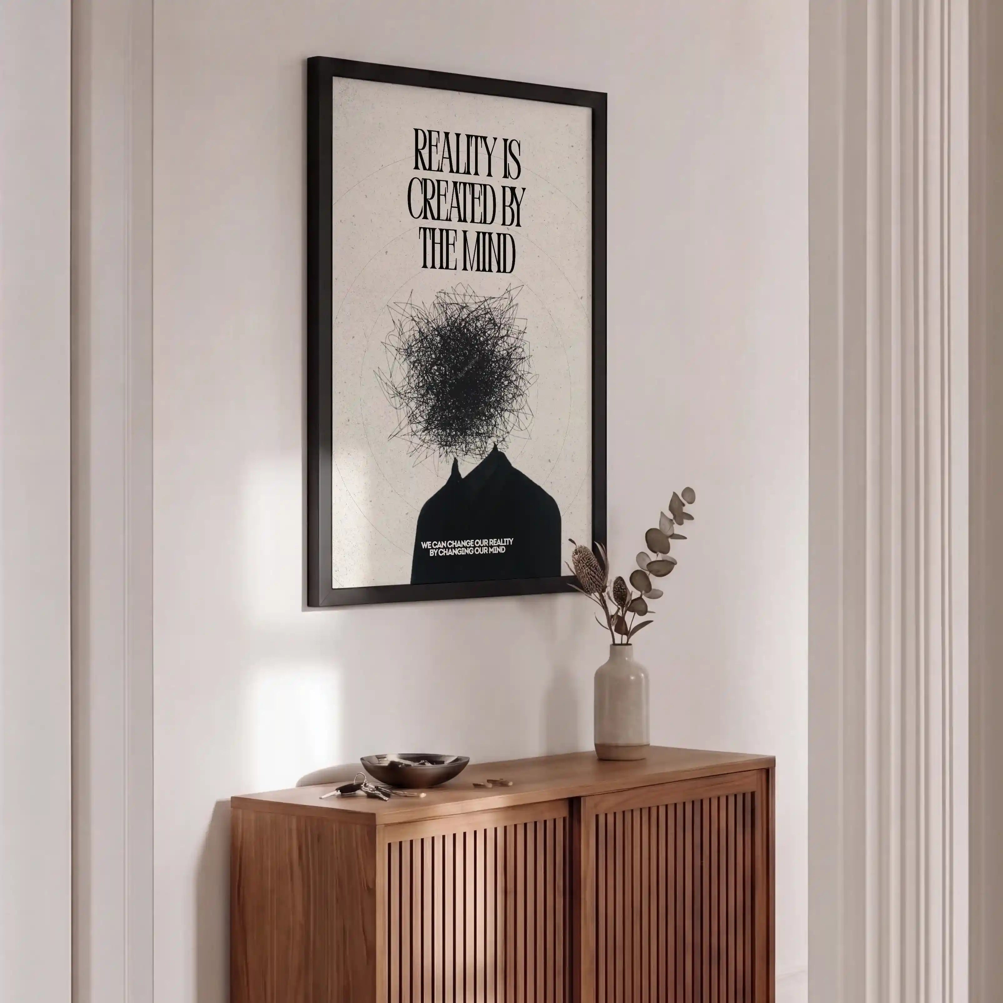 Wooden sideboard with a vase and decorative items, framed artwork on the wall.