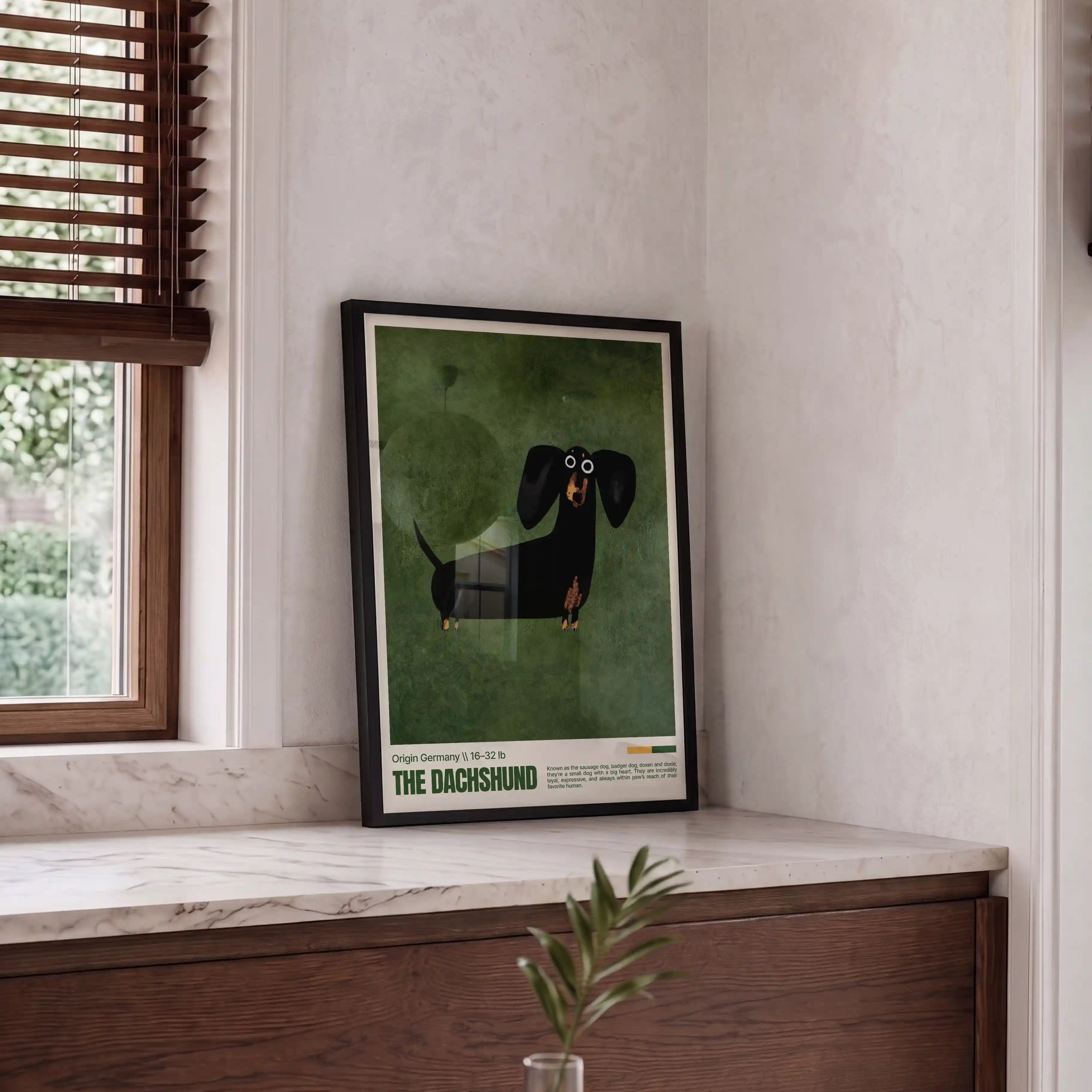 Framed artwork of a dachshund on a wall next to a window.